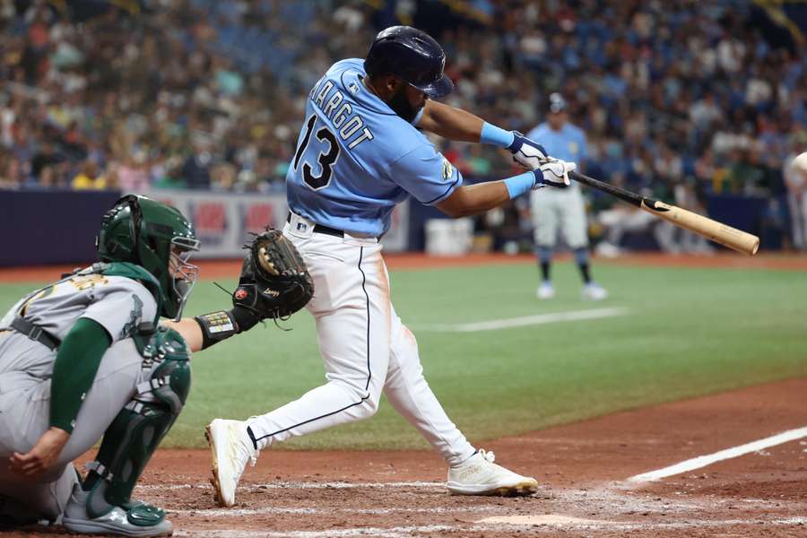 Tampa Bay Rays right fielder Manuel Margot (13) hits a home run against the Oakland Athletics