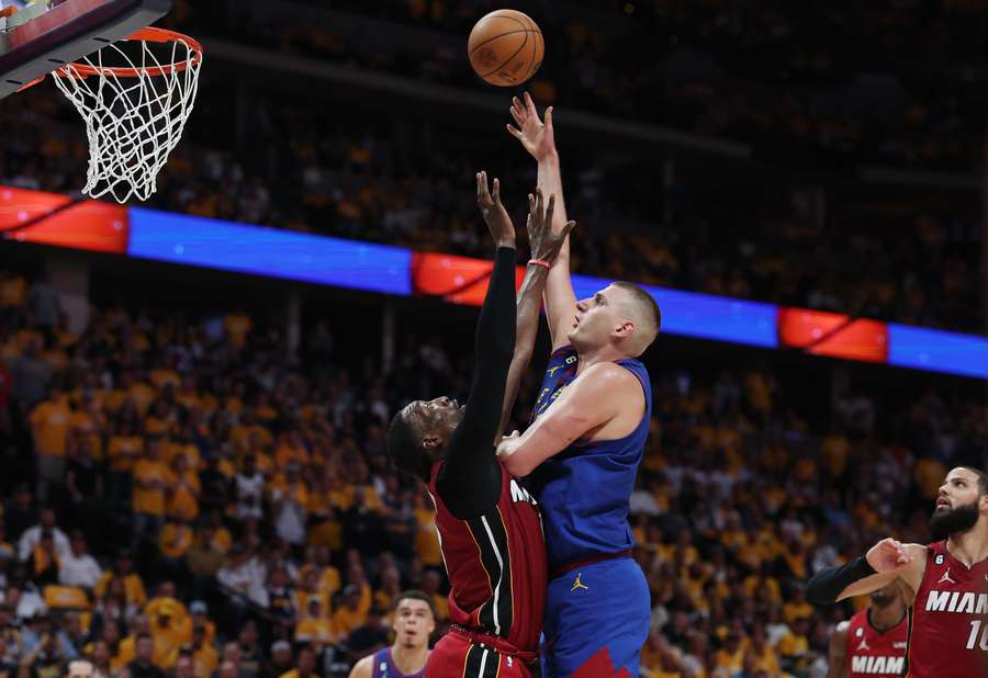 Nikola Jokic #15 of the Denver Nuggets shoots over Bam Adebayo #13 of the Miami Heat during the second quarter