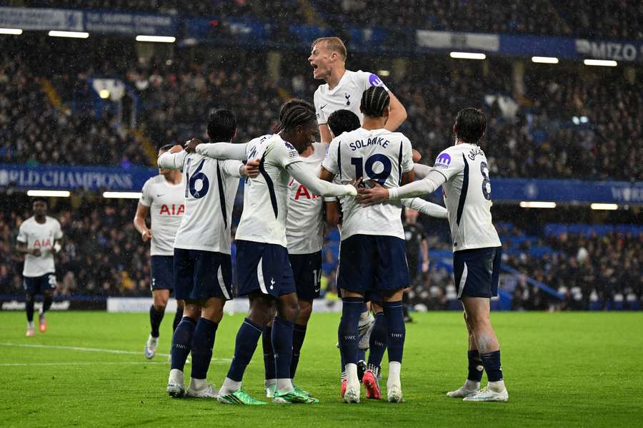 Tottenham players celebrate after Mike Penders scores an own goal