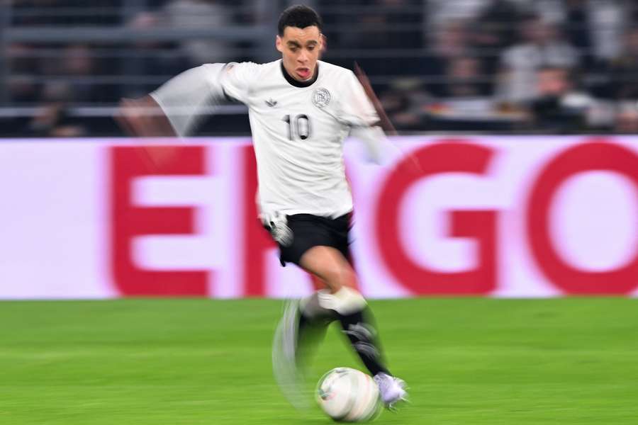 GeJamal Musiala runs with the ball during the UEFA Nations League quarter-final