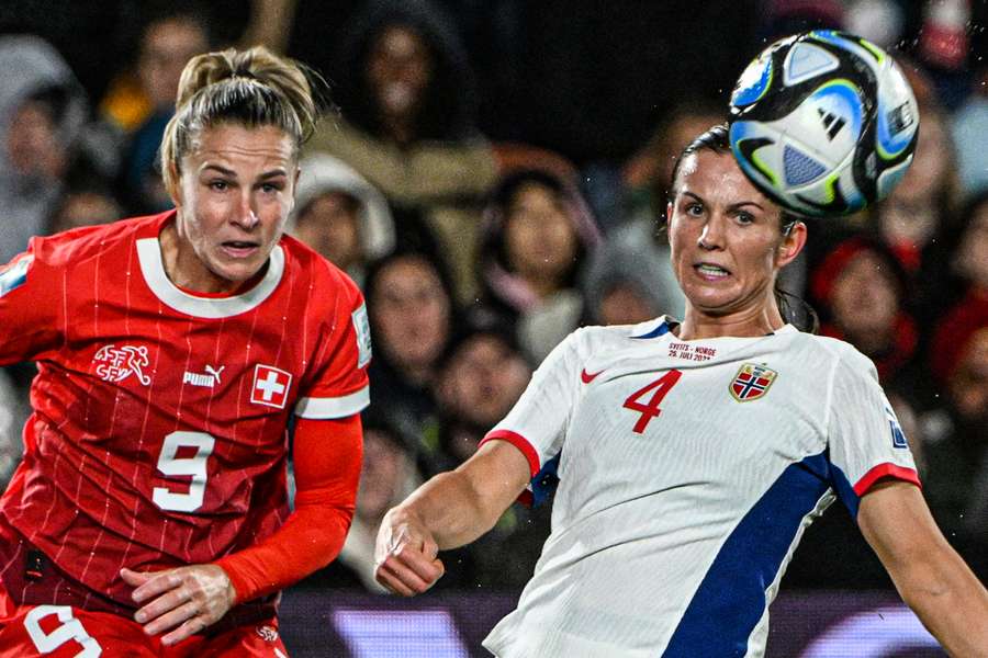 Switzerland's forward #09 Ana-Maria Crnogorevic (L) and Norway's defender #04 Tuva Hansen (R) eye the ball Switzerland's forward #09 Ana-Maria Crnogorevic (L) and Norway's defender #04 Tuva Hansen (R) eye the ball