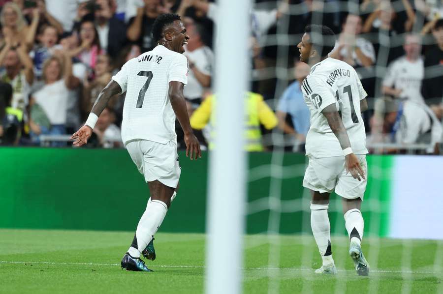 Vinicius (L) celebrates another goal