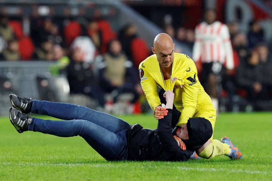 UEFA opens probe after Sevilla keeper attacked by fan on pitch