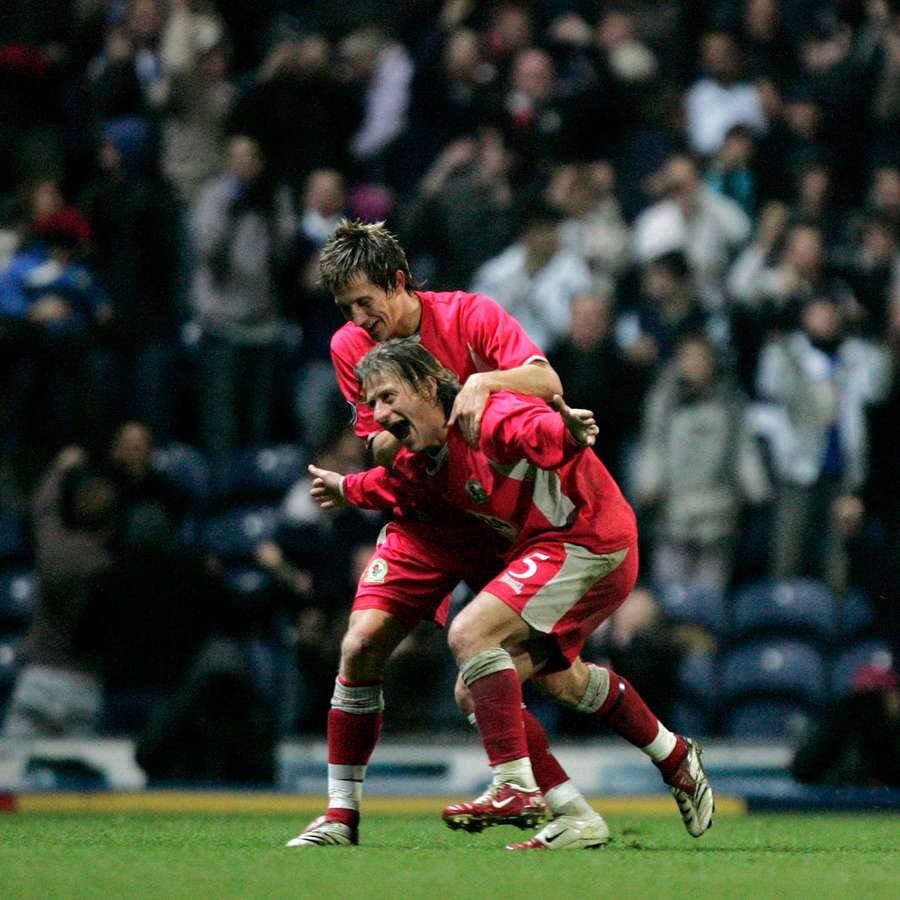 Pedersen and Tugay celebrate a goal. Pedersen and Tugay celebrate a goal.