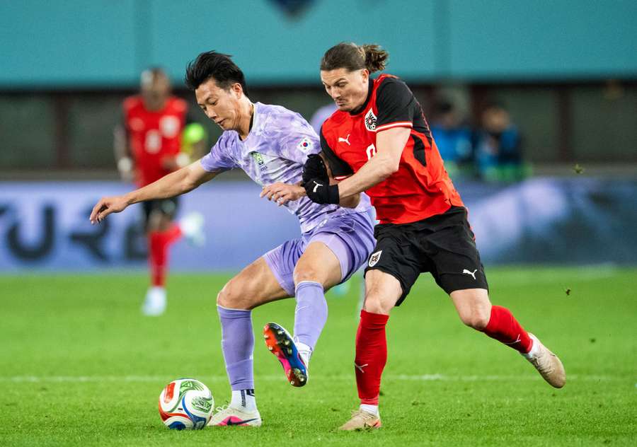 Lee Han-beom and Austria's Marcel Sabitzer vie for the ball during a friendly in Vienna Lee Han-beom and Austria's Marcel Sabitzer vie for the ball during a friendly in Vienna
