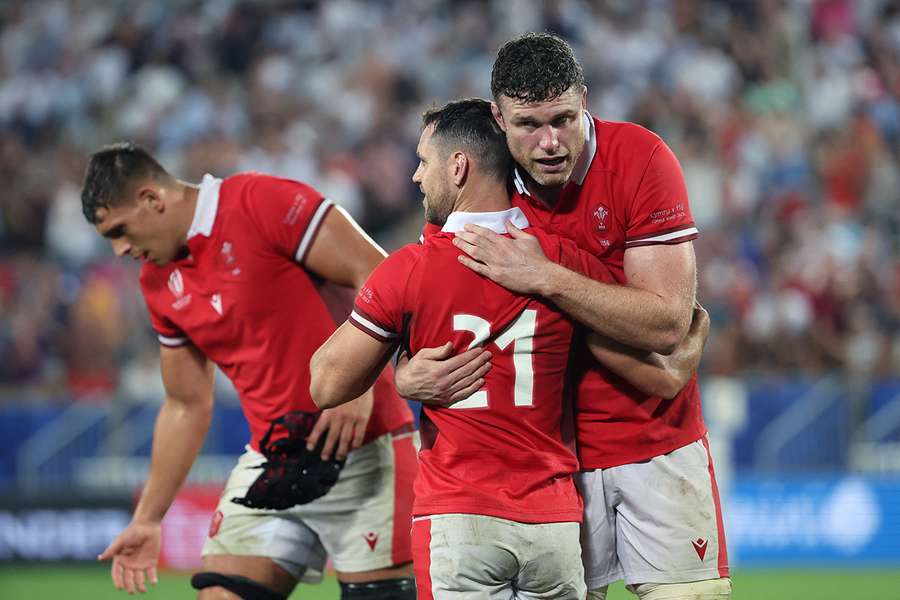 Wales' lock Will Rowlands (R) celebrates with Wales' scrum-half Tomos Williams