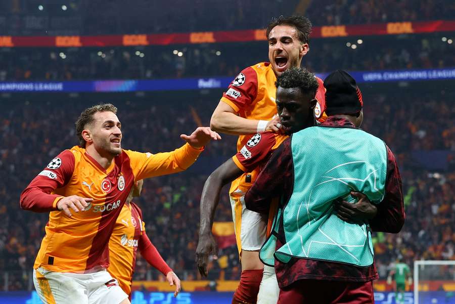 Galatasaray's Davinson Sanchez celebrates scoring their third goal with Baris Alper Yilmaz and Yunus Akgun