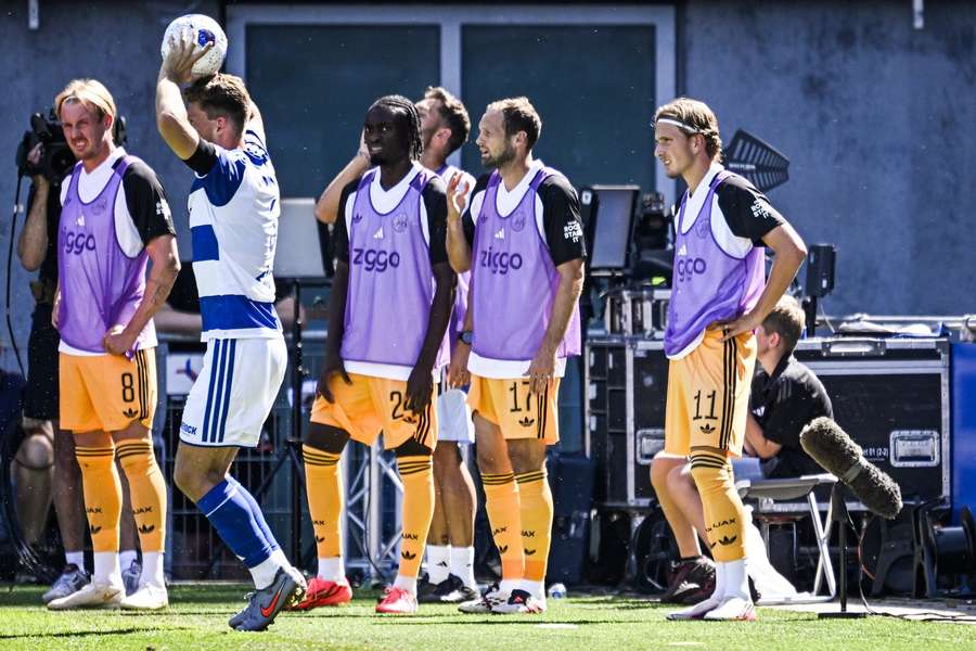 Mika Godts (R) warms up during Ajax's match against PEC Zwolle Mika Godts (R) warms up during Ajax's match against PEC Zwolle