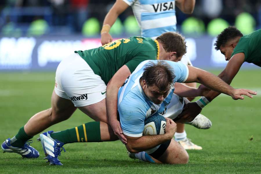 Argentina's prop Tomas Rapetti is tackled by South Africa's Jan-Hendrick Wessels. Argentina's prop Tomas Rapetti is tackled by South Africa's Jan-Hendrick Wessels.