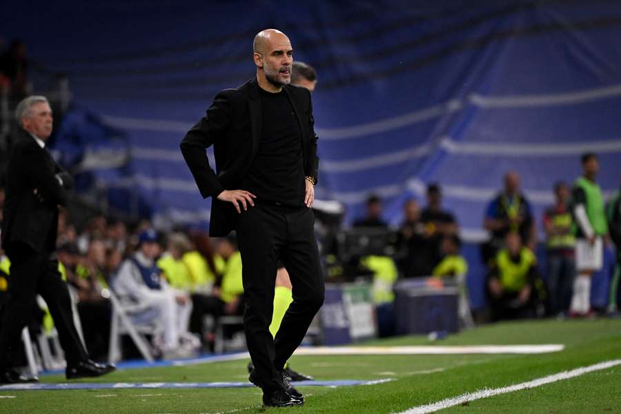 Pep Guardiola looks on Pep Guardiola looks on