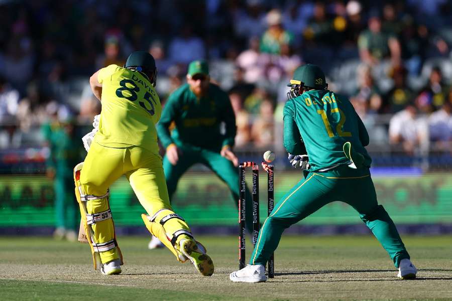 Australia's Tim David is bowled out by South Africa's Keshav Maharaj