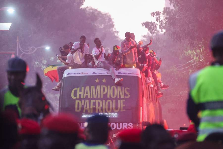 Senegal's players celebrate their AFCON win with an open bus parade Senegal's players celebrate their AFCON win with an open bus parade