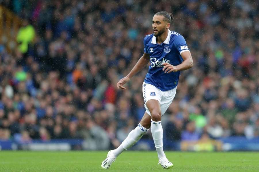 Everton players celebrate their side's third goal of the game, scored by Wolverhampton Wanderers' Craig Dawson