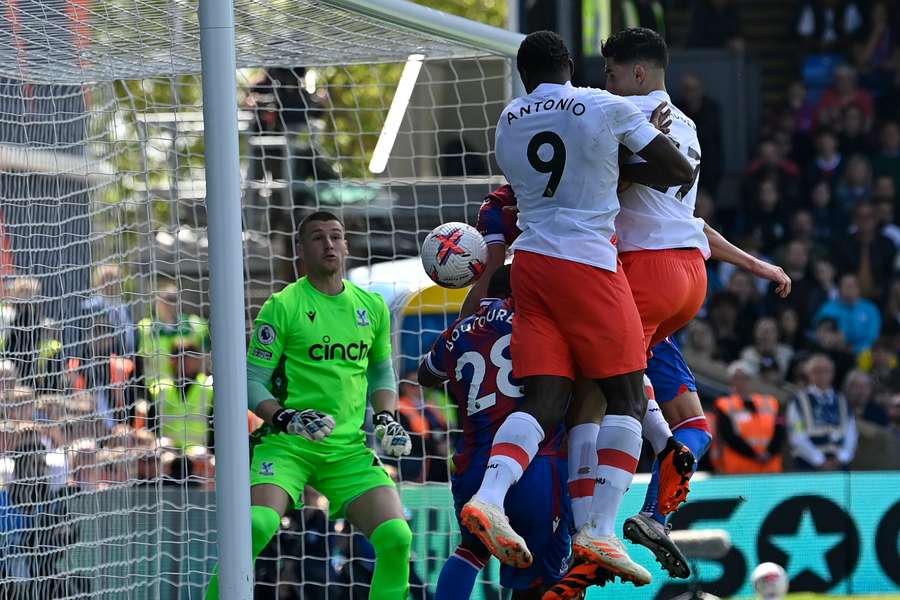 West Ham United's Moroccan defender Nayef Aguerd (R) heads home their third goal