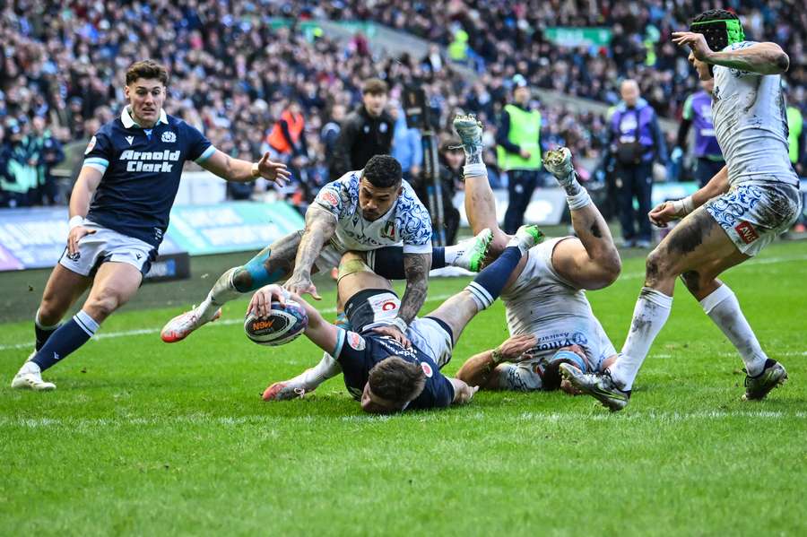 Huw Jones scores a try during last year's Scotland v Italy Six Nations encounter.
