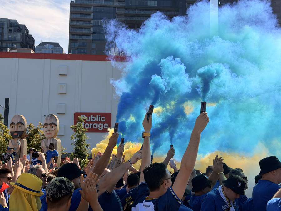 Bosnia fans light the flares before the game