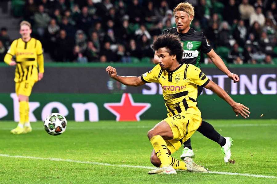 Dortmund's Karim Adeyemi (front) scores 