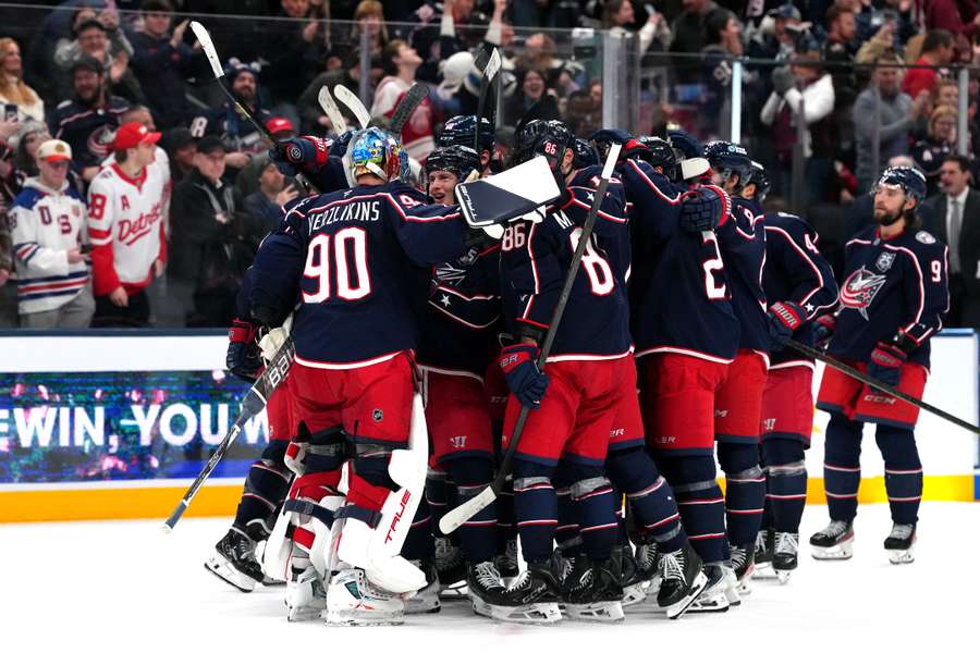 The Columbus Blue Jackets celebrate defeating the Detroit Red Wings in a shootout in NHL action. The Columbus Blue Jackets celebrate defeating the Detroit Red Wings in a shootout in NHL action.