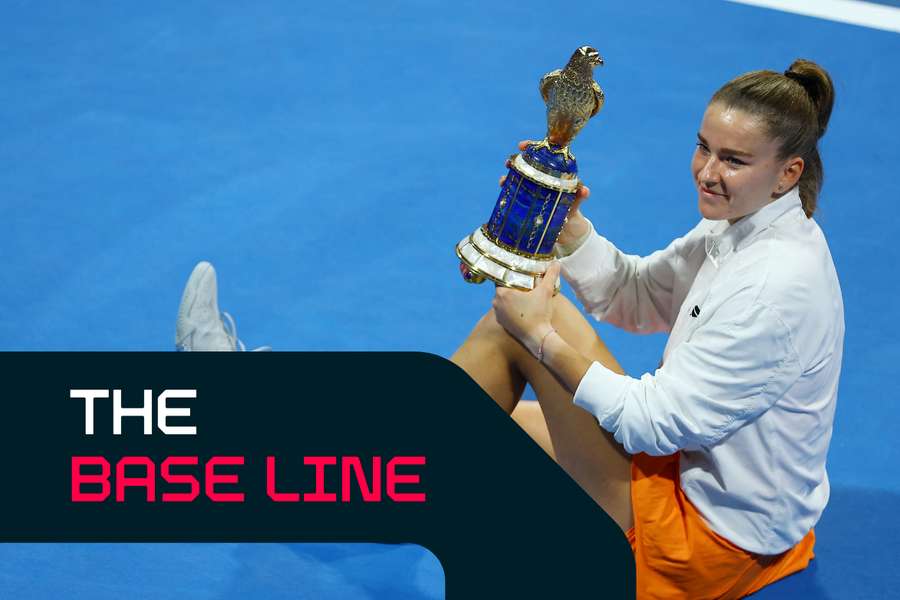 Muchova poses with the trophy in Doha