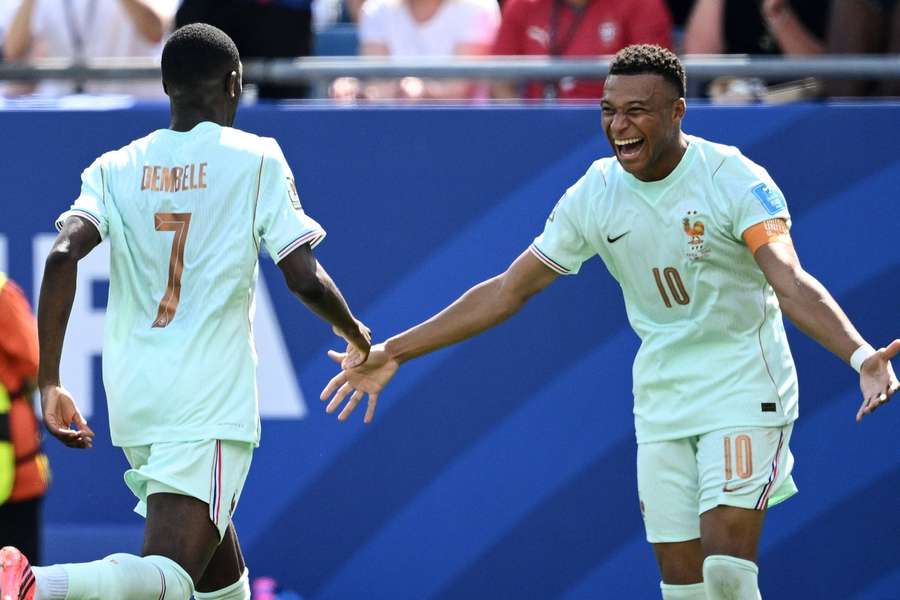 Ousmane Dembele and Kylian Mbappe celebrate a French goal against Norway