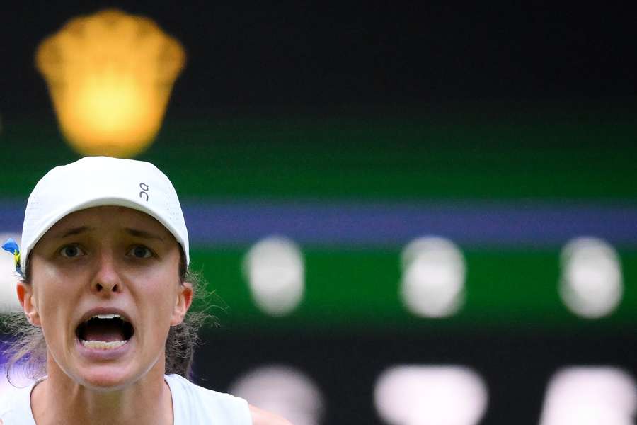 Poland's Iga Swiatek celebrates winning against Switzerland's Belinda Bencic