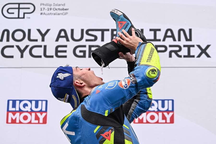 Raul Fernandez performs the time-honoured 'shoey' on the podium at Phillip Island. Raul Fernandez performs the time-honoured 'shoey' on the podium at Phillip Island.