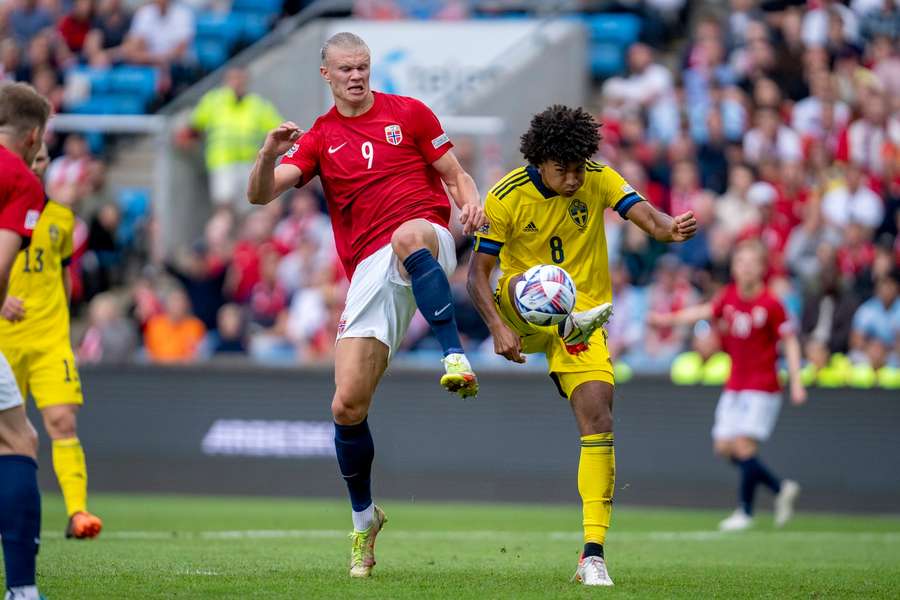 Erling Braut Haaland (left) and Sweden's Jens Cajuste battle for the ball in a Nations League clash in 2022