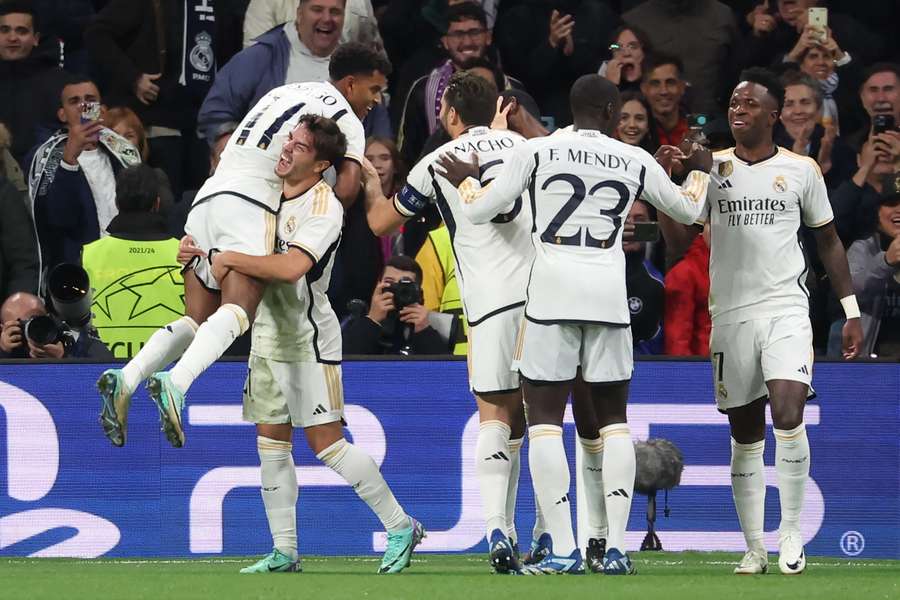 Real Madrid's Brazilian forward #11 Rodrygo (L) celebrates scoring his team's third goal