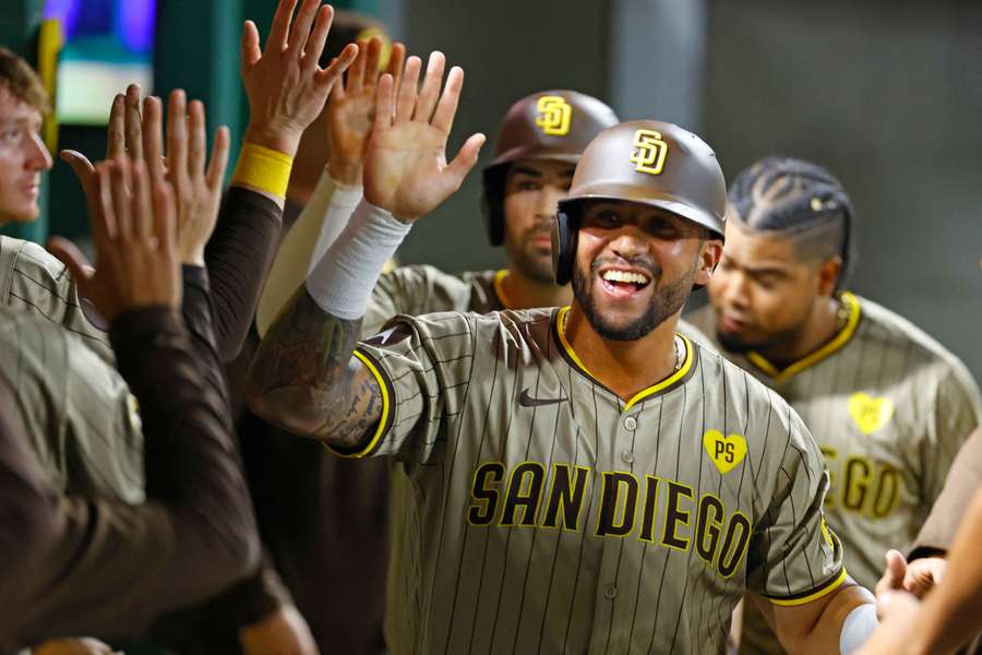 Donovan Solano celebrating with Padres teammates after hitting a two-run single (2024)