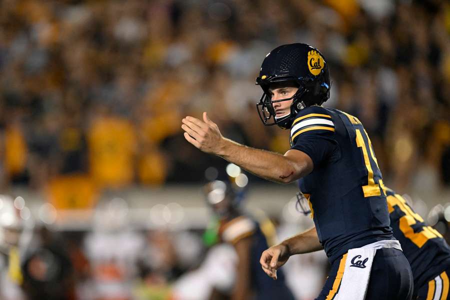 California quarterback Fernando Mendoza signalling motion to one of his teammates in a game against the Miami Hurricanes