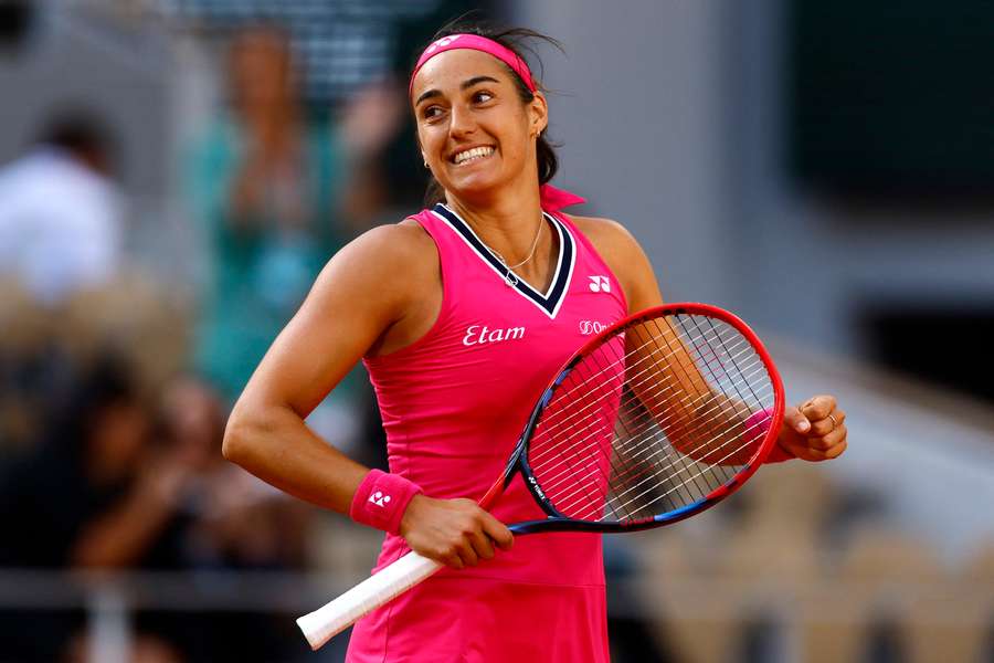 Caroline Garcia celebrates winning her first round match against China's Xiyu Wang