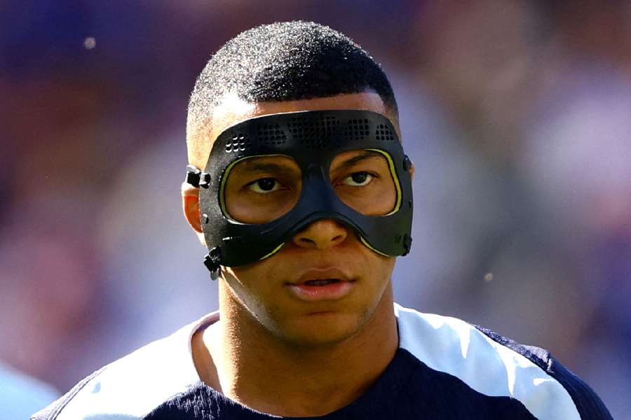 France's Mbappe in action with mask