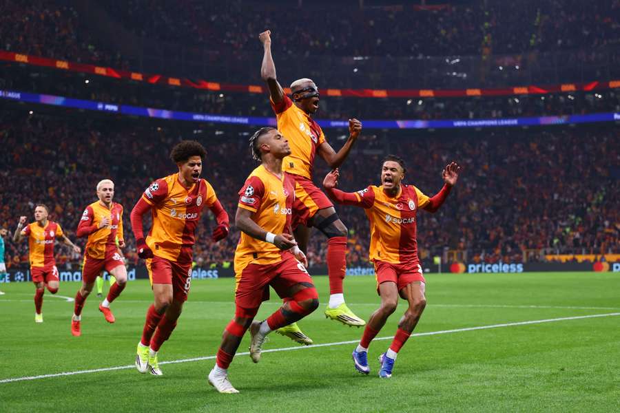 Galatasaray's Mario Lemina celebrates scoring their first goal with Victor Osimhen
