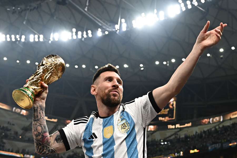 Messi holds the World Cup trophy after Argentina beat France in the final in Doha last December