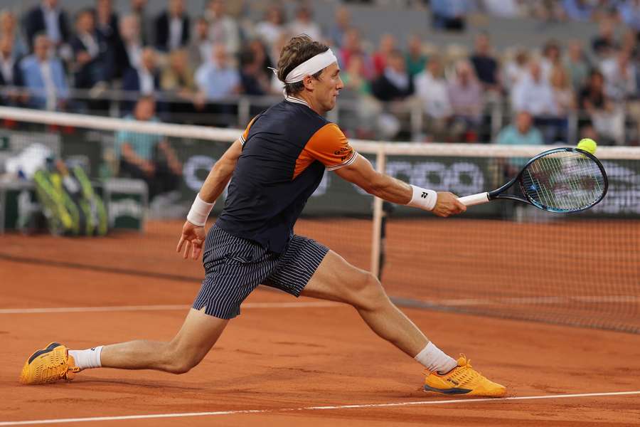 Norway's Casper Ruud plays a forehand return to Denmark's Holger Rune