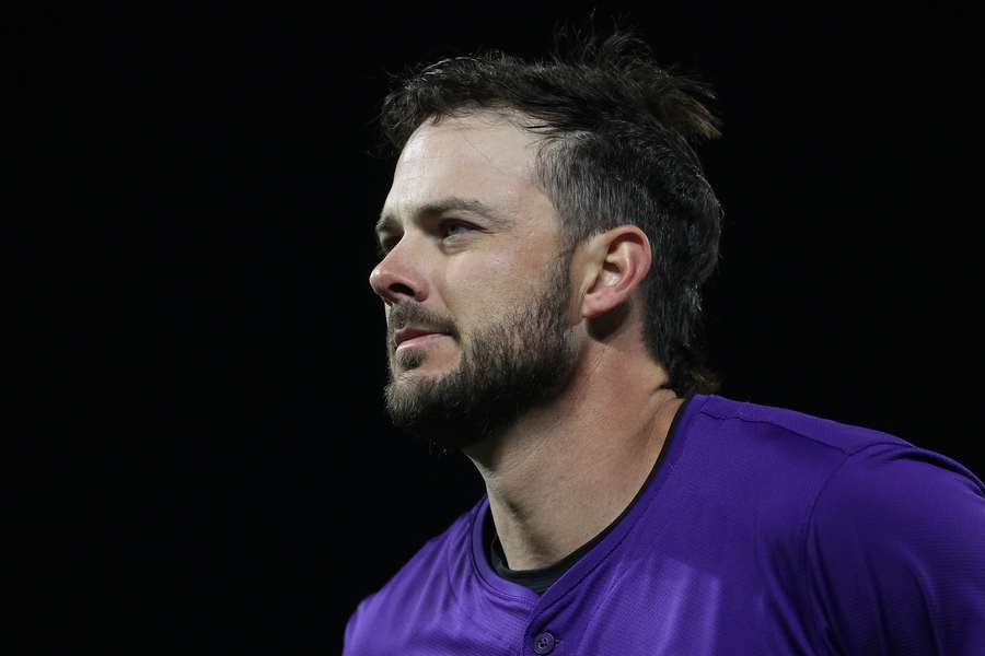 Kris Bryant taking a break in between innings during a game against the Arizona Diamondbacks