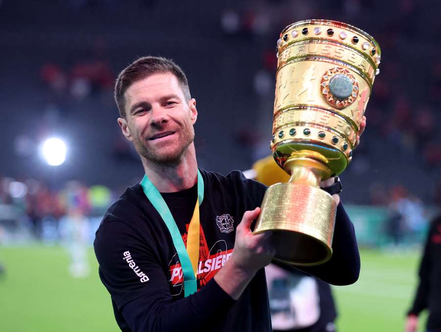 Xabi Alonso with the DFB Pokal trophy after winning the double with Bayer