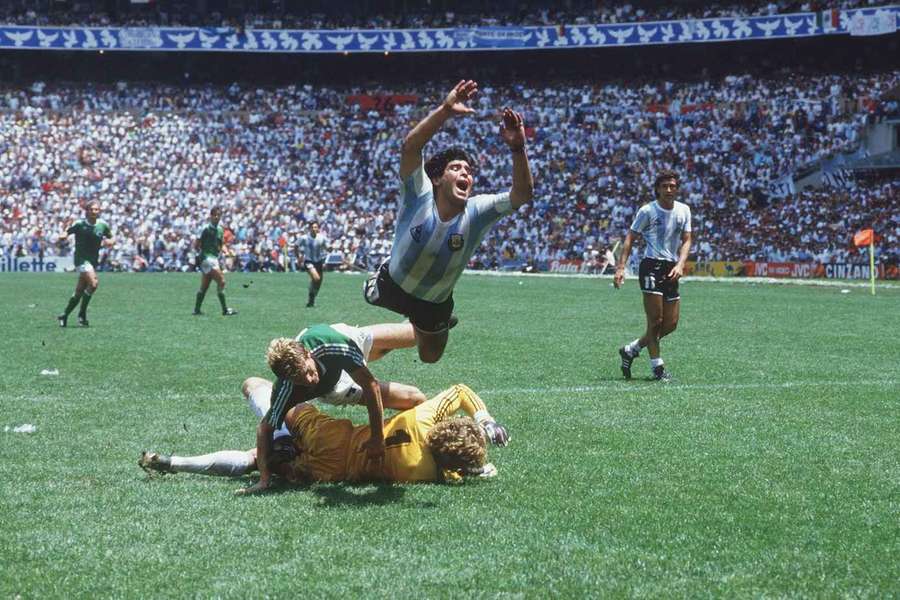 Maradona jumps over German keeper Harald 'Toni' Schumacher during the 1986 World Cup final