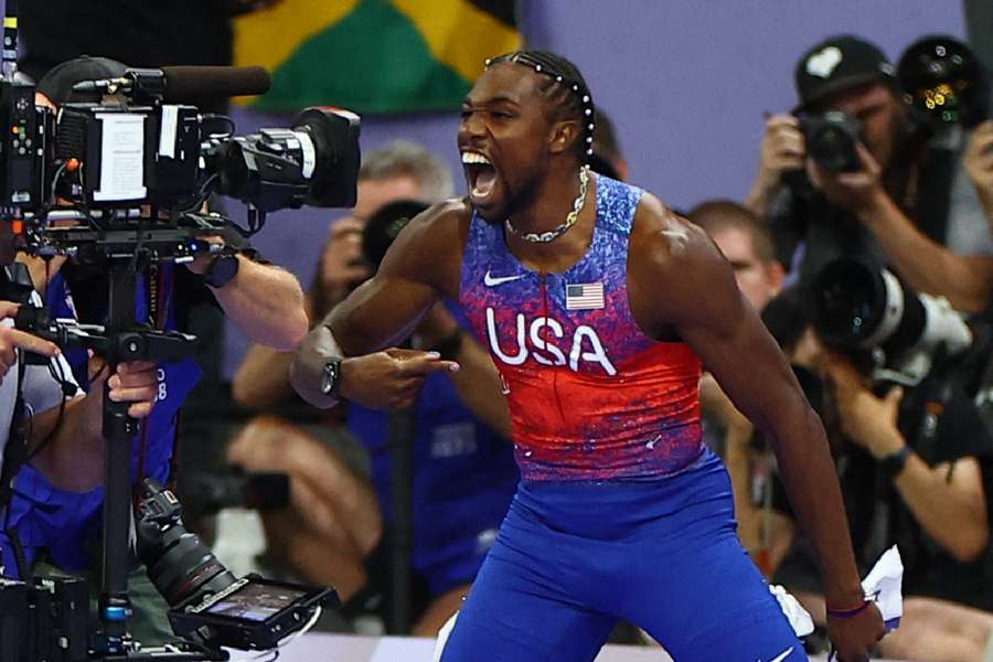 American Noah Lyles celebrates his incredible 100m victory