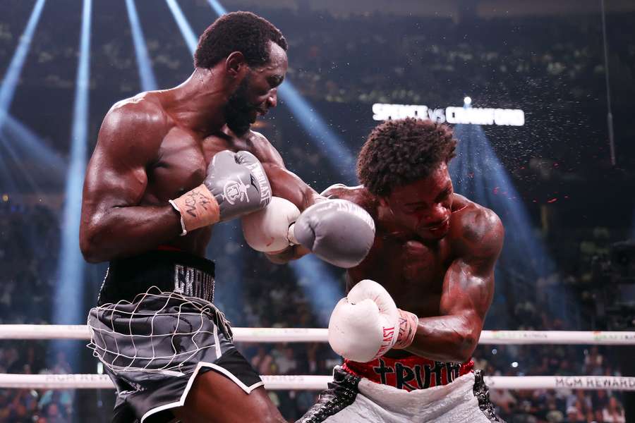 Terrence Crawford punches Errol Spence Jr. during the World Welterweight Championship bout