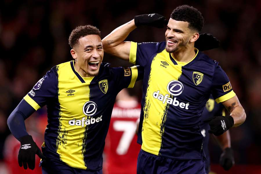 Dominic Solanke celebrates with Marcus Tavernier after scoring Bournemouth's third goal and completing his hat-trick