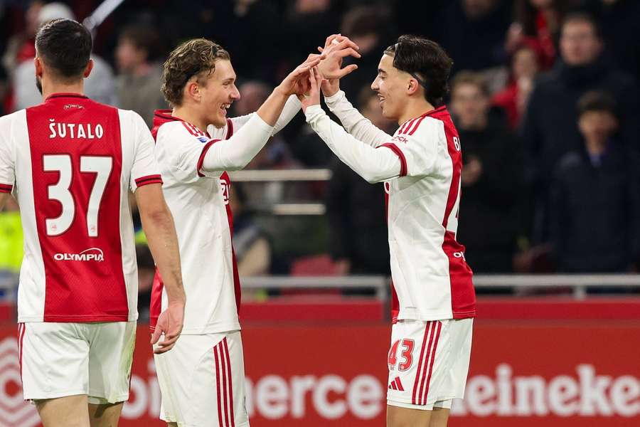 Ajax's Rayane Bounida (R) celebrates scoring his first Eredivisie goal with compatriot Mika Godts