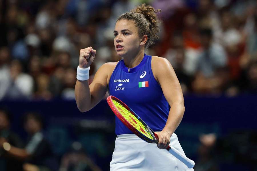 Jasmine Paolini celebrates after scoring a point against Wang Xinyu