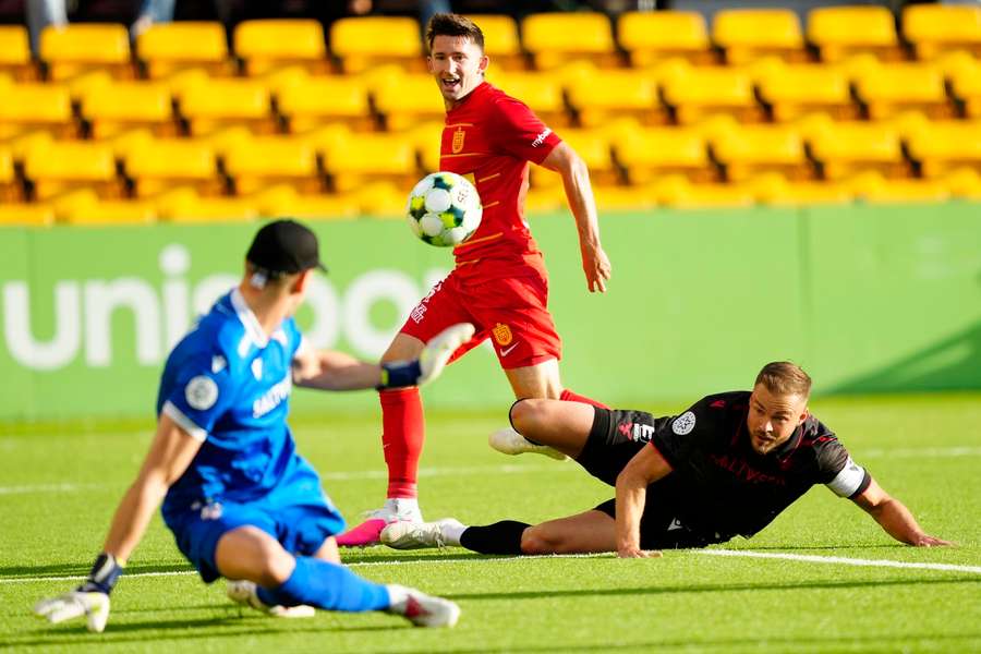 FC Nordsjaelland 's Mark Brink and Valur's Holmar Orn Eyjolfsson eyes the ball during the UEFA Conference League clash. FC Nordsjaelland 's Mark Brink and Valur's Holmar Orn Eyjolfsson eyes the ball during the UEFA Conference League clash.