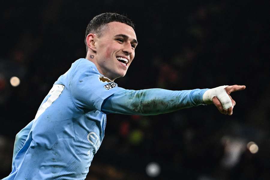 Manchester City's English midfielder #47 Phil Foden celebrates after scoring his team's third goal