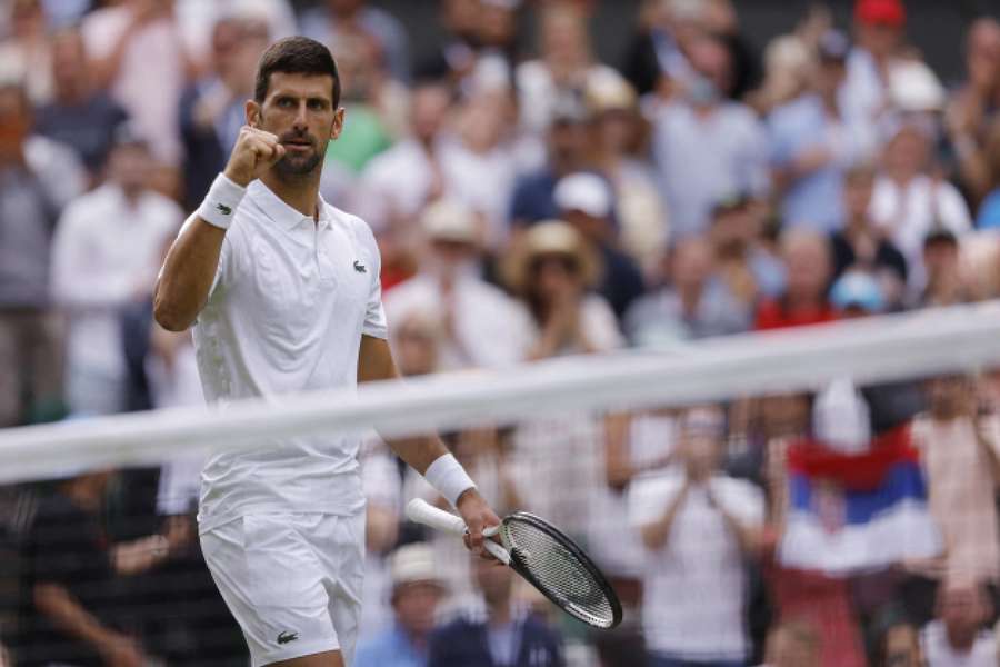 Novak Djokovic celebrates after winning his first-round match against Pedro Cachin