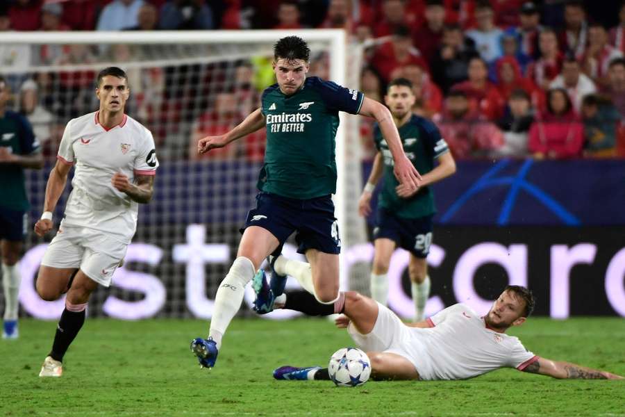 Sevilla midfielder Ivan Rakitic tackles Arsenal's Declan Rice