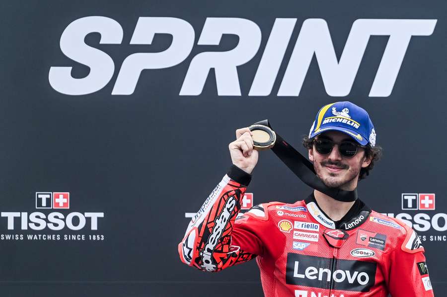 First-placed Ducati Italian rider Francesco Bagnaia celebrates on the podium