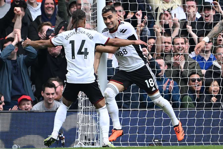 Fulham midfielder Andreas Pereira (R) celebrates with Bobby Decordova-Reid (L)
