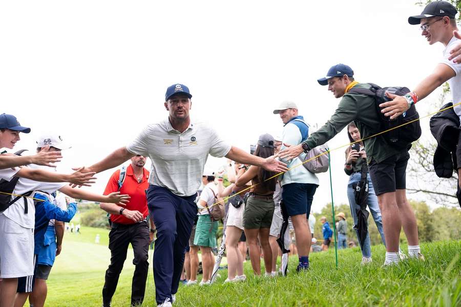 Bryson DeChambeau makes his way past fans in South Africa